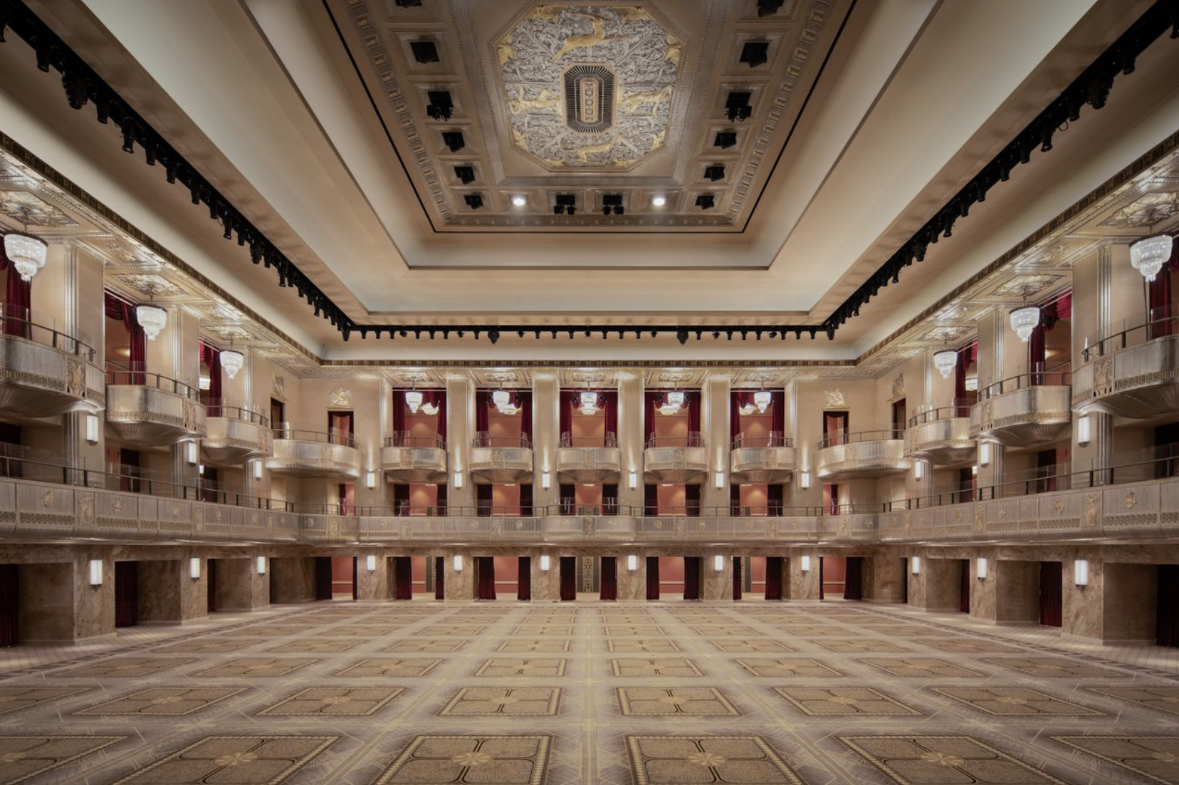an empty lit up ball room at waldorf astoria new york